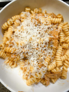 Fusilli pasta with tuna and roasted red pepper sauce topped with freshly grated parmesan