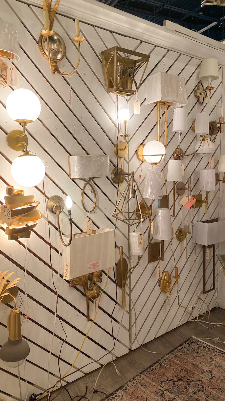 Wall with a variety of sconces on display